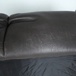 Two-seater sofa made of coarsely grained thick leather